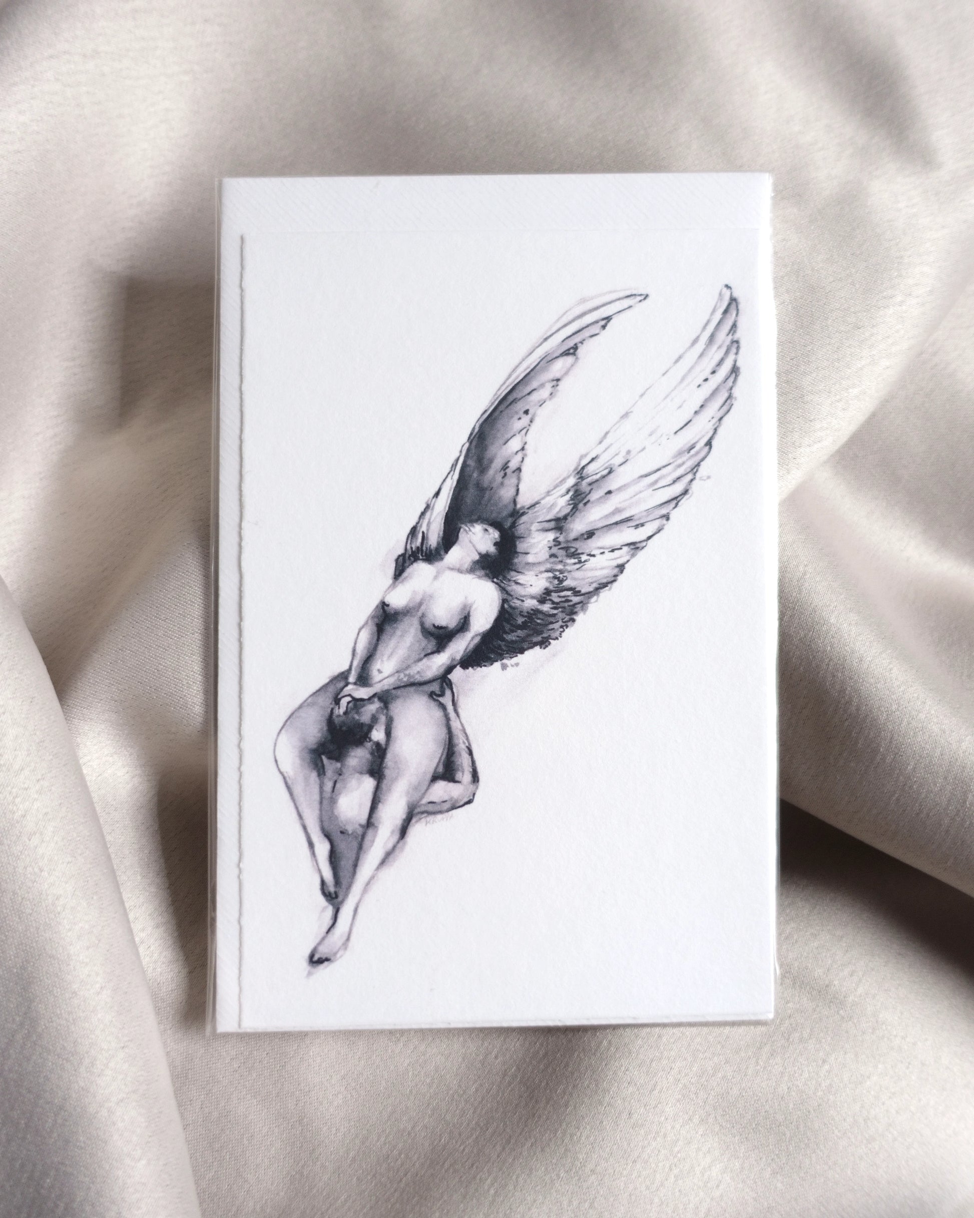 Erotic nude art greeting card "Silver Wings" by Tobias Kruppa, featuring a sensual scene of angels having oral sex / cunnilingus